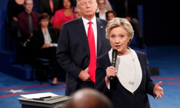 Hillary Clinton speaks as Do<em></em>nald Trump listens during a presidential debate